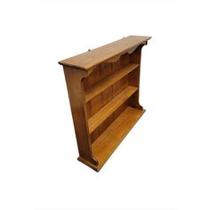 a wooden book shelf with three shelves on each side