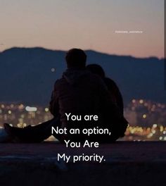 two people sitting on top of a hill with the words you are not an option, you are my priority