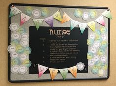 a bulletin board is decorated with colorful paper buntings and nurse's name