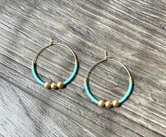 ~ Details ~ These boho style earrings are great for everyday, work, casual or just for a fun pop of color !  Genuine matte gold hematite, turquoise and matte gold colored glass seed beads. 1.25" inches in diameter in matte gold lightweight hoops (lead and nickel free plating over brass) ~ listing is for 1 pair of earrings ~ Join me on Instagram: www.instagram.com/therubyleo Join me on Facebook: www.facebook.com/therubyleo Join me on Pinterest: www.pinterest.com/therubyleo Nickel Free Bohemian Beaded Earrings For Everyday, Nickel Free Bohemian Beaded Earrings, Nickel-free Bohemian Beaded Earrings, Bohemian Nickel Free Beaded Earrings For Everyday, Everyday Bohemian Nickel-free Beaded Earrings, Hoop Earrings With Tiny Round Beads For Festivals, Festival Hoop Earrings With Tiny Beads, Bohemian Beaded Hoop Earrings For Everyday, Everyday Bohemian Beaded Hoop Earrings