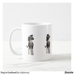 a white coffee mug with two dogs on it