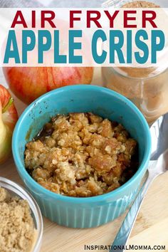 an air fryer apple crisp in a blue bowl next to apples and other ingredients