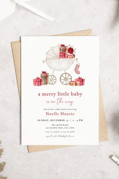 a merry little baby is on the way with presents and gifts in a white stroller