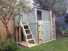 a small shed with a ladder to the side