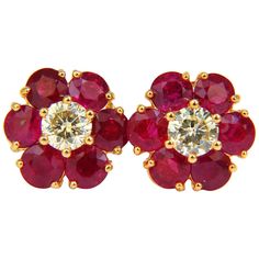 Ruby Cluster Glamour For the Executive look. Simple, yet sophisticated. 5.41ct. Natural Red Rubies Clean clarity, full round shape cuts All transparent. Gorgeous intense vivid hue The Classic Pigeon Blood Diamonds: 1.08ct. full cut rounds K color Si-1 clarity. 14KT yellow gold. 5.2 grams Comfortable Stud Over all earrings diameter: 13.3 mm Depth:7.2mm Excellent design // Brilliant sparkles from all angles. Appraisal report to accompany: $9,500 Mens Diamond Stud Earrings, Blood Diamonds, Gem Ruby, Diamond Cluster Earrings, Fine Jewelery, Pearl And Diamond Earrings, Ruby Earrings, Ruby Jewelry, Red Earrings