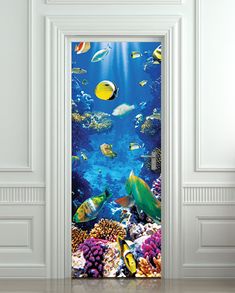 an open door with fish and corals on the ocean wallpaper in a white room