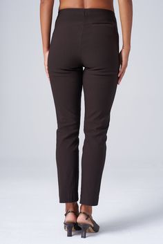 The slim, ankle-length version of the Original Magic Pant—the iconic piece that started it all. Designed to hug your curves perfectly, these pants blend structure with stretch for effortless all-day style. Whether dressing up for a presentation or going casual for coffee, meet your versatile go-to from 9 to 5 and beyond. THE DETAILS High-waisted, pull-on construction with no zippers or side seams offers a sleek, flattering silhouette. Perfect blend of structure and stretch holds you in all the r Brown Stretch Dress Pants With Tapered Leg, Brown Cropped Leg Workwear Bottoms, Stretch Brown Pants For Work, Brown Cropped Leg Bottoms For Workwear, Brown Cropped Leg Work Pants, Brown Cropped Leg Pants For Work, Stretch Brown Bottoms For Workwear, Brown Stretch Bottoms For Work, 9 To 5