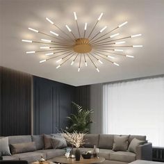 a living room with a couch, coffee table and large circular light fixture in the ceiling