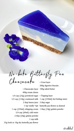 a piece of cheesecake sitting on top of a white plate next to a blue flower