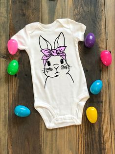 "🐰 This adorable bunny will be your Little's favorite this Easter! 🐰 Create your perfect bodysuit or shirt by choosing from available vinyl colors to customize the bandana color to your liking. Bunny outline will be black. Looking for the boy match? Click here! 👇 https://etsy.me/3K3exX6 🐰 Carter's® white shortsleeve bodysuit (A family favorite of our twins!) -100% cotton (baby soft!) -Reinforced snaps -Machine washable -Choose your size Preemie - 24 months 🐰 Gerber Colored Onesie® -100% cot Bunny Outline, Bunny With Bow, Easter Clothes, Baby Easter Gifts, Bandana Colors, Easter Bunny Girl, Easter Baby, Clothes Girl, Adorable Bunny