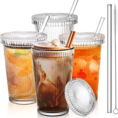 three different types of drinks in glasses with straws