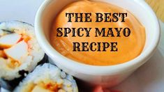 the best spicy mayo recipe is in a white bowl on a plate with sushi