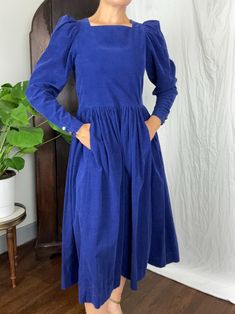 FEATURES: Original 80s Laura Ashley long sleeved corduroy dress. Super soft, velvety corduroy. Square neckline, puff sleeves, gathered skirt, front pockets.  COLOR: Cobalt blue ERA: 1980s TAG: Laura Ashley, Made in Great Britain FABRIC: Cotton Corduroy CLOSURE: Zips up back CONDITION: Excellent vintage condition, no issues to note  APPROX SIZE: Small (possibly medium, but the bust fits smaller than the waist) -MEASUREMENTS- Chest: 35" Waist: 33" Length (shoulder to hem): 46.5" *If package is marked delivered by the carrier, but you didn't receive it, you must report it to the carrier for them to investigate/try to re-deliver. All items I ship are insured. I do this for your benefit so you have a remedy for items lost/damaged in shipping.  *My items are used vintage and should expect to sho Laura Ashley 1980s, Laura Ashley 80s, Dress Puff Sleeve, 80s Dress, Corduroy Dress, Gathered Skirt, Nashville Tn, Laura Ashley, Dress Clothes For Women