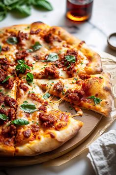 a pizza sitting on top of a wooden cutting board