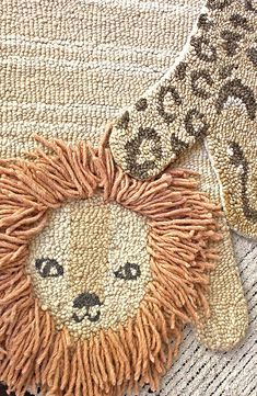 a close up of a rug with a lion on it