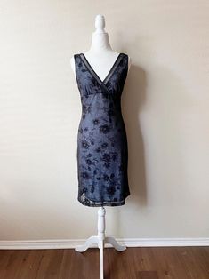 ~* ALL ITEMS ARE UNIQUE VINTAGE PIECES *~ ITEM DESCRIPTION: This vintage y2k black and blue glittery semi-formal dress is such a fairy glam dream. Perfect for a school dance or a cocktail party. Material is 75% Nylon/25% Metallic with a 100% Polyester lining, and is quite stretchy. Garment has been gently worn and is still in excellent condition.  SIZE: Medium  MEASUREMENTS: (All measurements are taken while the garment is laying flat. Please note that vintage sizing is not always the same as modern day sizing and the exact measurements will ensure the best fit. Bust, Waist, and Hips measurements are already doubled.)  Shoulders: 12 in. Arm Opening Length: 7.5 in. Bust: 31 in. Waist: 27 in.  Hips: 35 in. Total Length: 38.5 in. Planet Moody works hard to ensure all items are in the best con Semi Formal Cocktail Dress, Semi Formal Dress, Y2k Black, Formal Cocktail Dress, School Dance, Vintage Y2k, Vintage Pieces, Dress Clothes For Women, Formal Dress