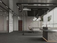 an empty office space with concrete walls and flooring is pictured in this image, there are plants hanging from the ceiling