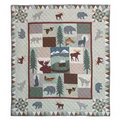 a quilt with animals and trees on it