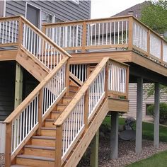 two story house with stairs leading up to the second floor