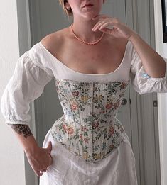 "This listing is for one fully custom Victorian corset, built on a pattern from 1869, appropriate for silhouettes up through the 1880s. This particular model has many narrow bones to give a very flexible shape around the body, and has cording along the top of the bust area. There are a very limited number of spots in the production calendar for this corset, and it takes 4-6 months to go from first measurements to finished corset. This is a beautifully lightweight corset, made with highest qualit 1700s Fashion, Modern Corset, Pixie Skirt, Victorian Corset, Corset Training, Corset Pattern, Duchess Satin, Strapless Corset, Corsets And Bustiers