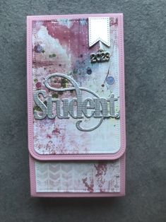 a pink and white card with the word student written on it's front side