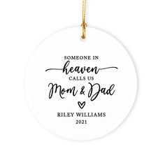 someone in heaven calls us mom and dad christmas ornament on a white background