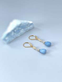 Dainty handmade Owyhee blue opal (Oregon Opal) dangle earrings for women.  Smooth light blue opal teardrop gemstones are wire wrapped in sterling silver, 14k Gold fill, or Rose Gold Fill and hang from sparkling crystals  Matching French hook or leverback earring backs available. Gemstone drops are dainty approx 8x6mm. Simple, elegant, lightweight everyday earrings. These would make lovely bridal or bridesmaid gift earrings. Blue Opal size: approx 8x10mm (approx 3/8" long) Overall Earring length: Gemstone Drop Earrings As A Gift For Her, Handmade Opal Drop Earrings, Opal Teardrop Jewelry Gift, Nickel-free 14k Gold-filled Drop Jewelry, Handmade Teardrop Opal Jewelry, Teardrop Opal Gemstone Jewelry, Nickel-free 14k Gold Filled Drop Jewelry, 14k Gold Filled Nickel-free Drop Jewelry, Handmade Opal Fine Jewelry