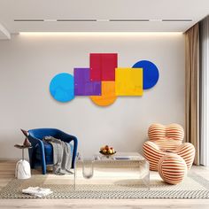 a living room filled with furniture next to a wall mounted art piece on the wall