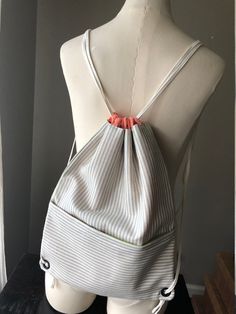 "This functional drawstring bag is handmade and complete with a drawstring opening keeping belongings secure.  Additionally, the front zipper provides a compartment for easy access making this the perfect bag for those on the go. 11 1/2\" x 15\"" Perfect Bag, Sewing Inspiration, Drawstring Bag, Drawstring Backpack, Front Zipper, Backpack Bags, The Go, Seattle, Backpacks