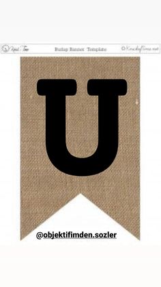 the letter u is made out of burlock and has black letters on it