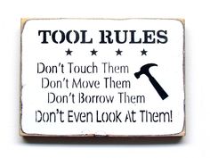 a sign that says, tool rules don't touch them don't move them don't borrow them don't even look at them