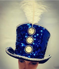 This is a  blue sequins  one off top hat by SDL. .fully lined and well made. It has silver trimming . This is a size 59 cm. It is an individual one off design  Thank you for looking High Crown Top Hat For Carnival, Silver Carnival Party Costume Hats And Headpieces, Silver Costume Hat For Carnival Party, Blue Costume Hat For Carnival, High Crown Top Hat For Carnival Costume, Carnival Costume Top Hat With High Crown, Blue Adjustable Costume Hats For Carnival, Adjustable Blue Costume Hats For Carnival, Carnival Festival High Crown Top Hat