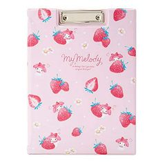 a pink notebook with strawberries on it and the words'my melody'written in white