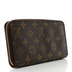 This is an authentic LOUIS VUITTON Monogram Zippy Wallet. This stylish wallet is crafted of Louis Vuitton monogram-coated canvas. It features a 3/4 wrap-around polished gold zipper that opens to a partitioned brown cross-grain leather interior with patch pockets, card slots, and a zipper compartment. Louis Vuitton Wallet, Gold Zipper, Leather Interior, Authentic Louis Vuitton, Louis Vuitton Monogram, Patch Pocket, Card Slots, Slots, Grain