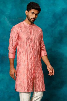 SHRESTHA BY VASTRAMAY Men's Onion Pink Embellished Kurta Add a touch of elegance to your ethnic wear collection with this delightful onion pink kurta by Vastramay. Crafted from breathable chanderi cotton, the kurta features intricate embellishments and a comfortable silhouette. Key Features Onion pink color Mandarin collar Front open closure Long regular sleeves Straight knee-length hem Specifications Material: Chanderi Cotton Sleeve Length: Long Material & Care This kurta is made from chanderi Onion Pink, Pink Kurta, Sleeveless Jacket, Full Sleeves, Ethnic Wear, Mandarin Collar, Full Sleeve, Front Open, Pink Color