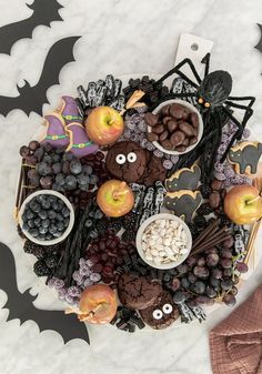 a table topped with halloween treats and candies