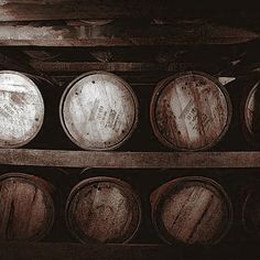 several wooden barrels stacked on top of each other