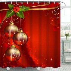 a christmas themed shower curtain with three ornaments hanging from it's side and holly on top