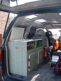 the back door of a van filled with furniture