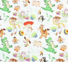 an image of children's cartoon characters on white fabric with green and red accents