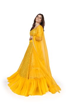 For mesmerizing looks, you'll be head over heels for this Yellow Georgette lehenga choli set. Crafted with multi sequins embroidery work, this set is designed with a 4-meter flair, soft net dupatta and regular sleeve blouse with round neck. Floor length lehenga comes with a soft net dupatta, and customizations are available. Be ready to dazzle in this gorgeous ensemble! (Oh, and don't forget to dry clean!) No of Set - 3-piece set Color- Yellow Lehenga Choli Fabric - Georgette Stitch Type - Semi- Designer Yellow Sequin Sets, Yellow Bollywood Sharara With Sequins, Bollywood Style Yellow Sharara With Sequins, Bollywood Yellow Sequin Set, Yellow Anarkali Set With Sequins, Festive Yellow Sharara With Sequins, Festive Yellow Sequined Sharara, Yellow Sequined Choli For Party, Yellow Sequined Party Choli