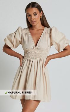 Get ready to turn heads in the Francesca V Neck Puff Sleeves Mini Dress! This neutral, A Line dress is made from 100% cotton for a comfortable and breathable fit. The flattering V neck adds a touch of elegance, while the puff sleeves add a playful and feminine twist. Perfect for any casual occasion, this mini dress is your go-to choice when you want to feel effortlessly stylish. Pair it with your favorite accessories and get ready to slay the fashion game!Product Details:A-line dress silhouetteM Cotton Puff Sleeve Ruched Dress For Day Out, Cotton Ruched V-neck Midi Dress, Cotton Puff Sleeve Mini Dress For Day Out, Cotton V-neck Ruched Midi Dress, Chic Cotton Puff Sleeve Dress, Cotton Puff Sleeve Dress For Day Out, Cotton Dresses With Puff Sleeves And Gathered Neckline, Cotton Puff Sleeve V-neck Dress For Daywear, Cotton Midi Dress With Puff Sleeves