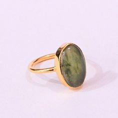 22K Gold Plated Ring, Green Aventurine Ring, Handmade Ring, Gemstone Brass Jewellery, Bezel Set Ring, Stacking Ring Product Details Item Code: BJBR-2550 Stone Name: Green Aventurine Stone Shape: Oval Stone Size: 10*16 mm Metal: 18K Yellow Gold Plated Over Brass Ring Sizes: Please choose from the drop-down menu. If you do not see your finger size, select custom, and I'll make a ring just for you!  Note:- These rings you will receive may vary slightly in color from the images because these are natural gemstones and vary to each other every single time and it is not possible to get the same color what is showing in the images. Images are for reference to get an idea of a similar color you will get. Shipping Info: All my items are safely and nicely packaged and shipped in a beautiful plastic b Aventurine Ring, Brass Jewellery, Green Aventurine Stone, Aventurine Stone, Bezel Set Ring, Ring Stacking, Set Ring, Gemstone Jewellery, Plated Ring