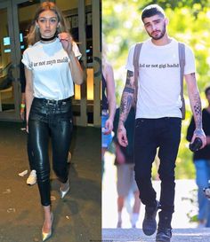 two people wearing t - shirts and black pants