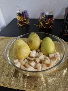 three pears and cubed potatoes in a glass bowl