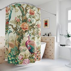 a bathroom with a shower curtain decorated with peacocks and flowers on the wall next to a bathtub