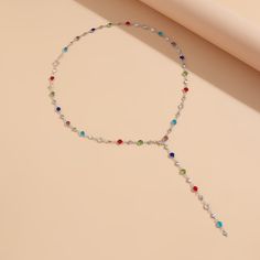 The Multicolor Beaded Lariat Necklace is a vibrant and playful addition to any jewelry collection. Crafted with a variety of colorful beads strung on a delicate gold-plated chain, this necklace is perfect for adding a pop of color to your outfits. The lariat design with a long, elegant drop creates a flattering look, making it a versatile piece for both casual and formal occasions. Details: Material: Gold-plated brass with multicolored beads Necklace weight: 12.4g (0.43oz) Length: 70cm (27.5in) Chain thickness: 0.6cm (0.23in) Colorful beaded accents along the chain with lariat drop design Missy Jewelry Lariat Necklace Collection This playful yet elegant necklace is ideal for those who love to make a colorful statement while maintaining a chic, sophisticated style. Colorful Beads Lariat Necklace Gift, Colorful Beads Lariat Necklace For Gift, Multicolor Lariat Long Necklace For Gifts, Adjustable Multicolor Lariat Necklace, Adjustable Multicolor Long Lariat Necklace, Elegant Multicolor Lariat Necklace, Adjustable Multicolor Lariat Necklace With Colorful Beads, Multicolor Beaded Lariat Necklace With Round Beads, Multicolor Beaded Chain Long Necklace For Party