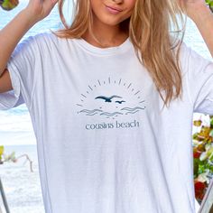 Cousins Beach Retro Beach T-Shirt, Cousins Beach Massachusetts, The Summer I Turned Pretty Inspired T-Shirt, TSITP Shirt This soft-style tee is perfect for any The Summer I Turned Pretty lover!  RETURNS OR EXCHANGES All of our items are printed as soon as you place your order, therefore we do not accept returns or exchanges.  If there are any issues with your item, please message us and we will work to find a solution. MATERIAL AND WASHING INSTRUCTIONS - 100% Cotton - Light and Soft fabric - Loose fit - Runs true to size - Wash inside out in cold water, on a gentle cycle.  - Air dry - Do not use fabric softener or bleach - Do not iron directly on the design Summer Beach T-shirt With Front Print, White Text Print Tops For Beach, White Text Print Top For Vacation, White Graphic Print T-shirt For Vacation, Summer White Print Short Sleeve Top, White Printed T-shirt For The Beach, White Print Short Sleeve Summer Top, White Print Relaxed Fit Top For Vacation, Casual White Print Tops For Vacation