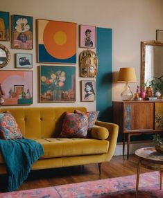 a living room filled with furniture and pictures on the wall