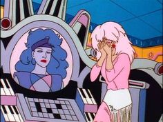 an animated image of a woman with pink hair talking on a cell phone next to a keyboard